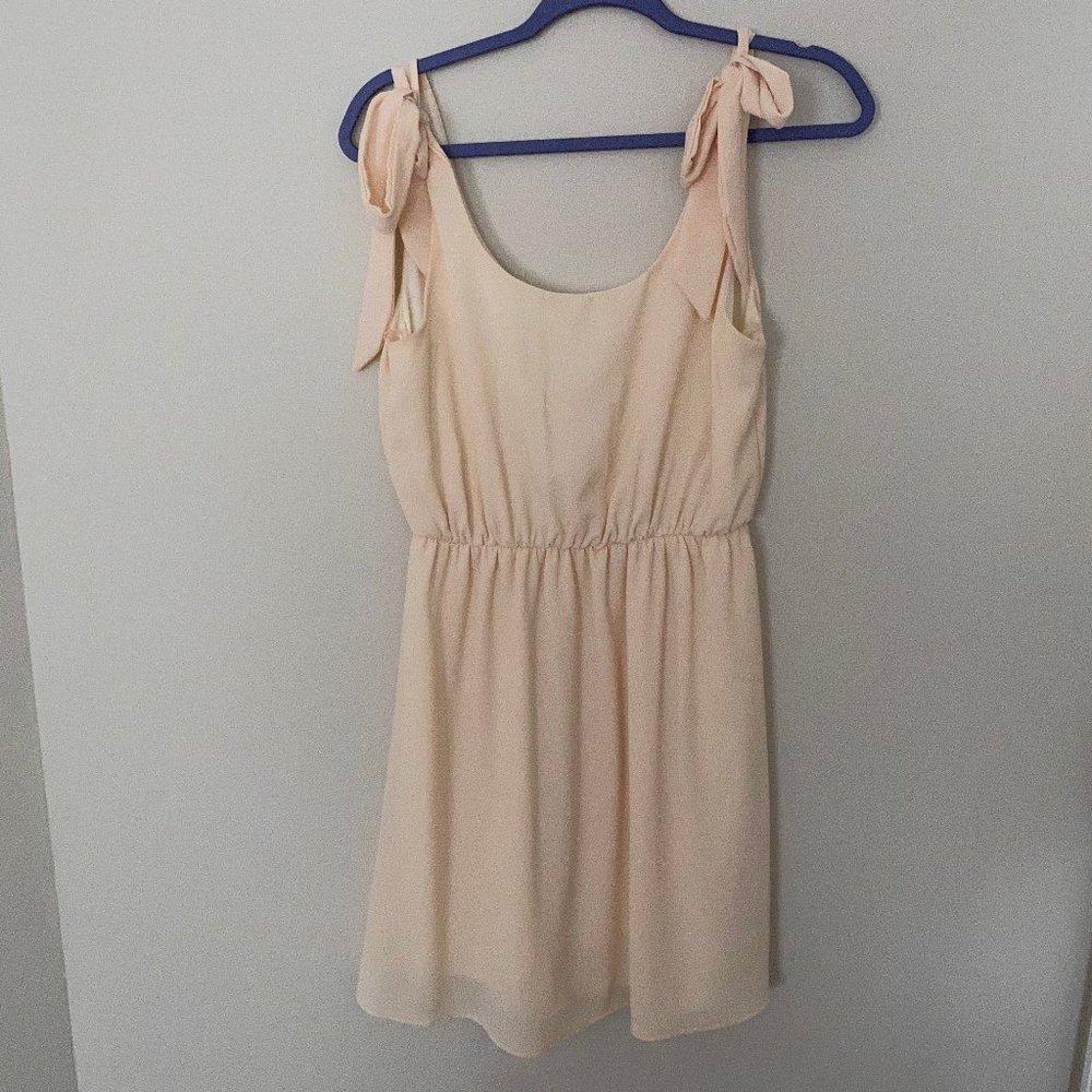 sleeveless cream dress with tie straps